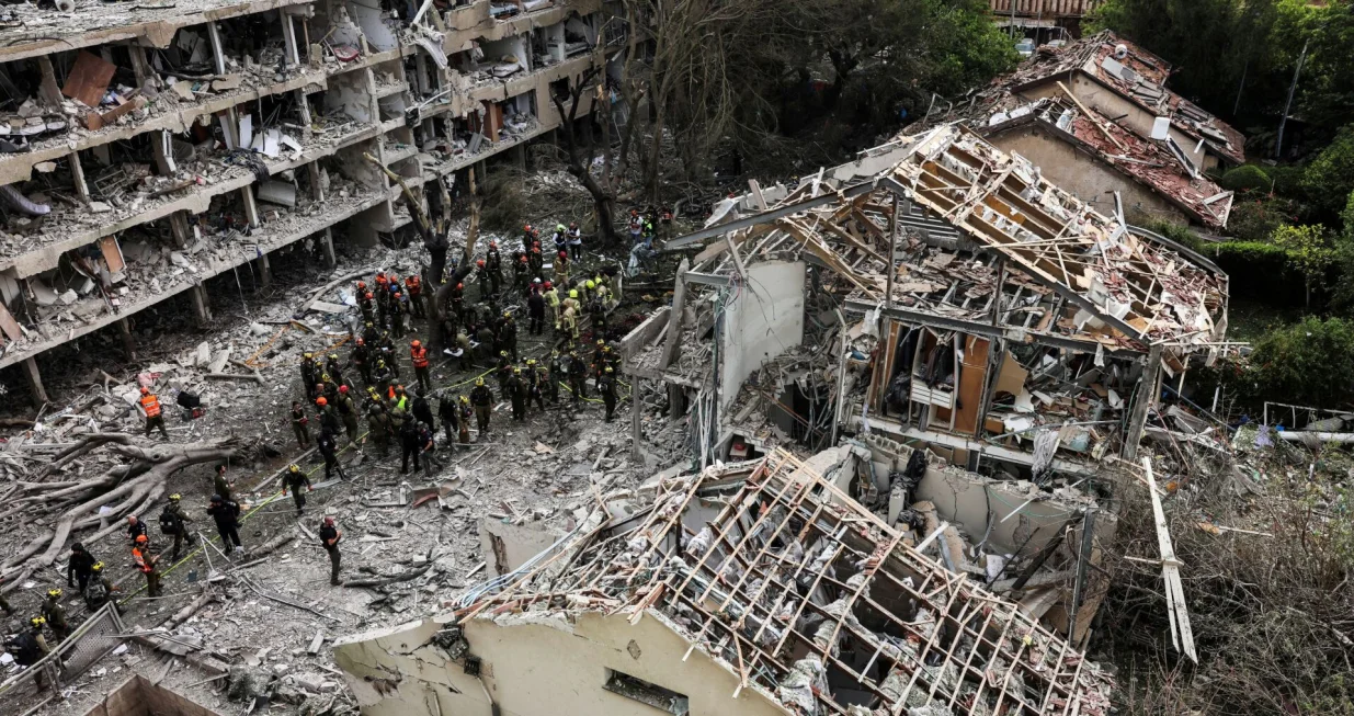 First responders gather at an impact site following Iran's strike on Israel, amid the Iran-Israel conflict, in Haifa, Israel, June 22, 2025. REUTERS/Florion Goga/Florion Goga