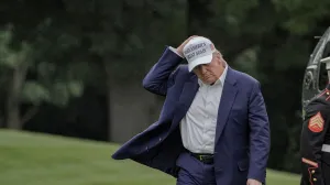 U.S. President Donald Trump holds his hat as he walks on the South Lawn of the White House in Washington, D.C., U.S., May 25, 2025. /Ken Cedeno/Ken Cedeno