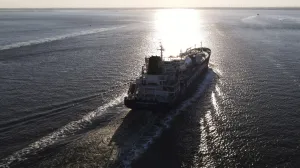 epa10116383 An aerial picture taken with a drone shows JS Ineos Innovatio (IMO Number 9744958) a LNG liquefied natural gas tanker on the Schelde River after leaving Antwerp harbour, Belgium, 11 August 2022, in direction of Rotterdam. EPA/OLIVIER HOSLET/Olivier Hoslet