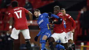 epa09115993 Paul Pogba (R) of Manchester United in action against Adam Lallana (C) of Brighton during the English Premier League soccer match between Manchester United and Brighton Hove Albion in Manchester, Britain, 04 April 2021. EPA/Phil Noble/POOL EDITORIAL USE ONLY. No use with unauthorized audio, video, data, fixture lists, club/league logos or 'live' services. Online in-match use limited to 120 images, no video emulation. No use in betting, games or single club/league/player publications.