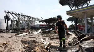 A firefighter works at the scene where a gas station exploded on the outskirts of Rome, Italy, July 4, 2025. REUTERS/Matteo Minnella  TPX IMAGES OF THE DAY/Matteo Minnella