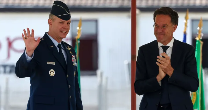 NATO Secretary General Mark Rutte applauds as U.S. Air Force General Alexus Grynkewich waves during a ceremony where Grynkewich takes over as NATO's new Supreme Allied Commander Europe (SACEUR), at the Supreme Headquarters Allied Powers Europe (SHAPE), in Casteau, Belgium July 4, 2025. REUTERS/Yves Herman/Yves Herman