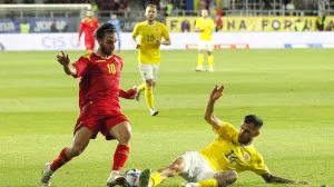 epa10013353 Marius Marin (R) of Romania in action against Ilija Vukotic (L) of Montenegro during the UEFA Nations League soccer match between Romania and Montenegro in Bucharest, Romania, 14 June 2022. EPA/ROBERT GHEMENT