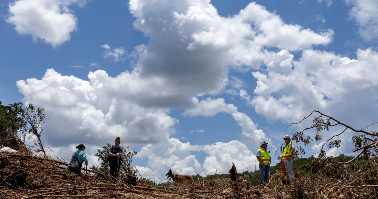 People take part in the search and rescue operation looking for missing people by the Guadalupe River, in Hunt, Texas, U.S. July 9, 2025. REUTERS/Umit Bektas/Umit Bektas