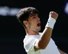 Tennis - Wimbledon - All England Lawn Tennis and Croquet Club, London, Britain - June 30, 2025 Spain's Carlos Alcaraz reacts during his first round match against Italy's Fabio Fognini REUTERS/Stephanie Lecocq  TPX IMAGES OF THE DAY