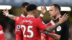 epa10259219 Referee Stuart Attwell (R) talks to Manchester United's Jadon Sancho (L) during the English Premier League soccer match between Chelsea FC and Manchester United in London, Britain, 22 October 2022. EPA/DANIEL HAMBURY EDITORIAL USE ONLY. No use with unauthorized audio, video, data, fixture lists, club/league logos or 'live' services. Online in-match use limited to 120 images, no video emulation. No use in betting, games or single club/league/player publications