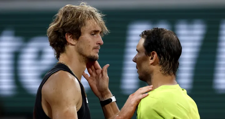 epa09994218 Alexander Zverev of Germany (L) reacts with Rafael Nadal of Spain after retiring due to an injury in the men's semi-final match during the French Open tennis tournament at Roland ​Garros in Paris, France, 03 June 2022. EPA/YOAN VALAT