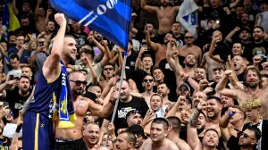 epa10159933 Miralem Halilovic of Bosnia and Herzegovina (L) celebrates with fans after winning the FIBA EuroBasket 2022 group B stage match between Bosnia and Herzegovina and Slovenia in Cologne, Germany, 04 September 2022. EPA/SASCHA STEINBACH