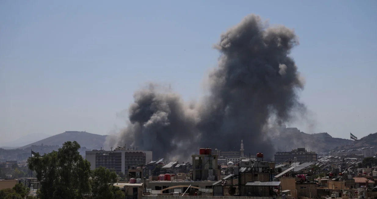 Smoke rises after Israeli strikes on Syria's defense ministry in Damascus, according to Al Jazeera TV, in Damascus, Syria July 16, 2025. REUTERS/Khalil Ashawi/Khalil Ashawi
