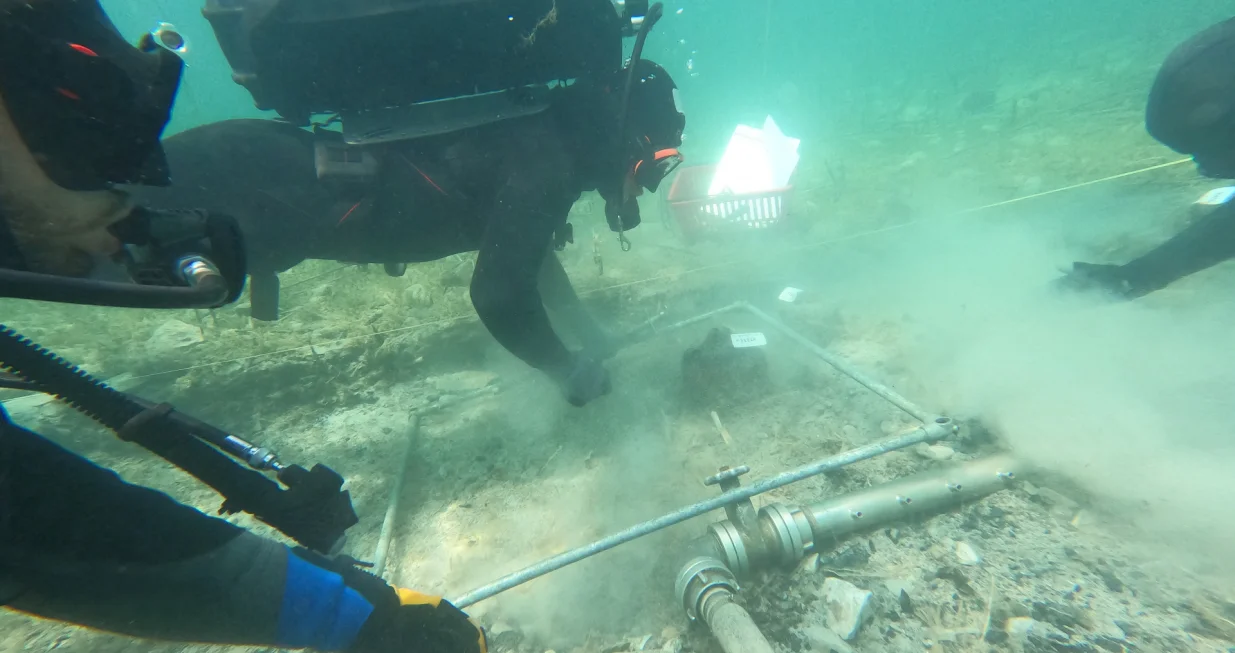 Archaeologists dive in the lake of Ohrid to uncover objects, in the village of Lin, Albania, July 11, 2025. LIN3/Kristi Anastasi/Handout via REUTERS THIS IMAGE HAS BEEN SUPPLIED BY A THIRD PARTY/Lin3/kristi Anastasi