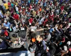 Palestinians gather to receive food from a charity kitchen, amid a hunger crisis, in Nuseirat, central Gaza Strip, July 20, 2025. REUTERS/Ramadan Abed/Ramadan Abed