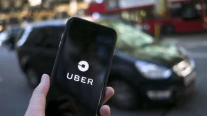 epa09023553 (FILE) - An Uber logo on a mobile telephone in central London, Britain, 22 September 2017 (re-issued 19 February 2021). The UK Supreme Court on 19 February 2021 ruled the Uber drivers are not not self-employed but workers. Uber, that has some 45,000 drivers working in London and that lost earlier court cases, said it would contact its active drivers across UK and discuss the operations. The ruling could mean Uber drivers may be entitled to holiday payments and minimum wages. EPA/WILL OLIVER *** Local Caption *** 55660504/Will Oliver