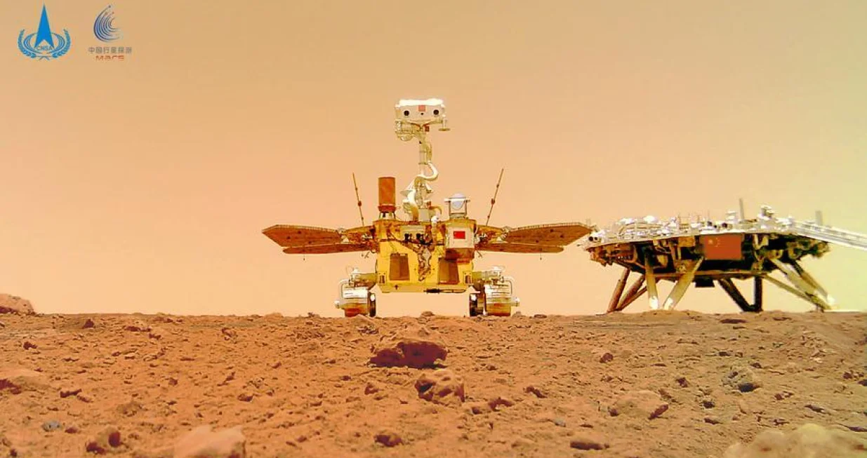 (210611) -- BEIJING, June 11, 2021 (Xinhua) -- Photo released on June 11, 2021 by the China National Space Administration (CNSA) shows a selfie of China's first Mars rover Zhurong with the landing platform. The China National Space Administration Friday released new images taken by the country's first Mars rover Zhurong, showing national flag on the red planet. The images were unveiled at a ceremony in Beijing, signifying a complete success of China's first mars exploration mission. The images include the landing site panorama, Martian landscape and a selfie of the rover with the landing platform. (CNSA/Handout via Xinhua)/Jin Liwang