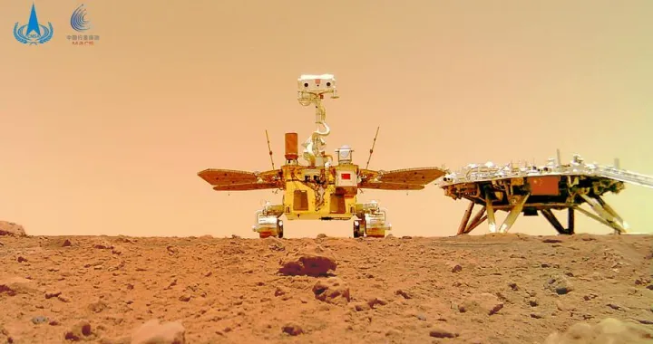 (210611) -- BEIJING, June 11, 2021 (Xinhua) -- Photo released on June 11, 2021 by the China National Space Administration (CNSA) shows a selfie of China's first Mars rover Zhurong with the landing platform. The China National Space Administration Friday released new images taken by the country's first Mars rover Zhurong, showing national flag on the red planet. The images were unveiled at a ceremony in Beijing, signifying a complete success of China's first mars exploration mission. The images include the landing site panorama, Martian landscape and a selfie of the rover with the landing platform. (CNSA/Handout via Xinhua)/Jin Liwang