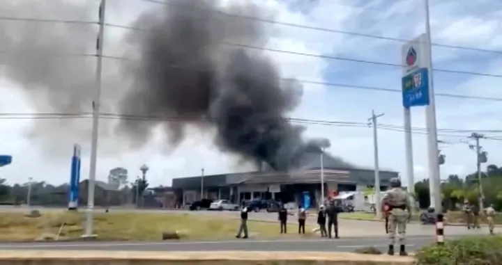 Smoke rises from a convenience store at a gas station, amid the clashes between Thailand and Cambodia, in Kantharalak district, Sisaket province, Thailand, July 24, 2025, in this screengrab obtained from a handout video. TPBS/Handout via REUTERS THIS IMAGE HAS BEEN SUPPLIED BY A THIRD PARTY. THAILAND OUT. NO COMMERCIAL OR EDITORIAL SALES IN THAILAND./Tpbs