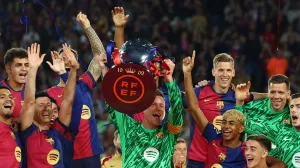 Soccer Football - LaLiga - FC Barcelona v Villarreal - Estadi Olimpic Lluis Companys, Barcelona, Spain - May 18, 2025 FC Barcelona's Marc-Andre ter Stegen lifts the trophy with teammates after winning LaLiga REUTERS/Albert Gea