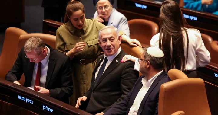 Israeli Prime Minister Benjamin Netanyahu speaks with National Security Minister Itamar Ben-Gvir, at the plenum in the Knesset, Israel's parliament, ahead of a vote over possible expulsion of Ayman Odeh from parliament, in Jerusalem, July 14, 2025. REUTERS/Ronen Zvulun/Ronen Zvulun
