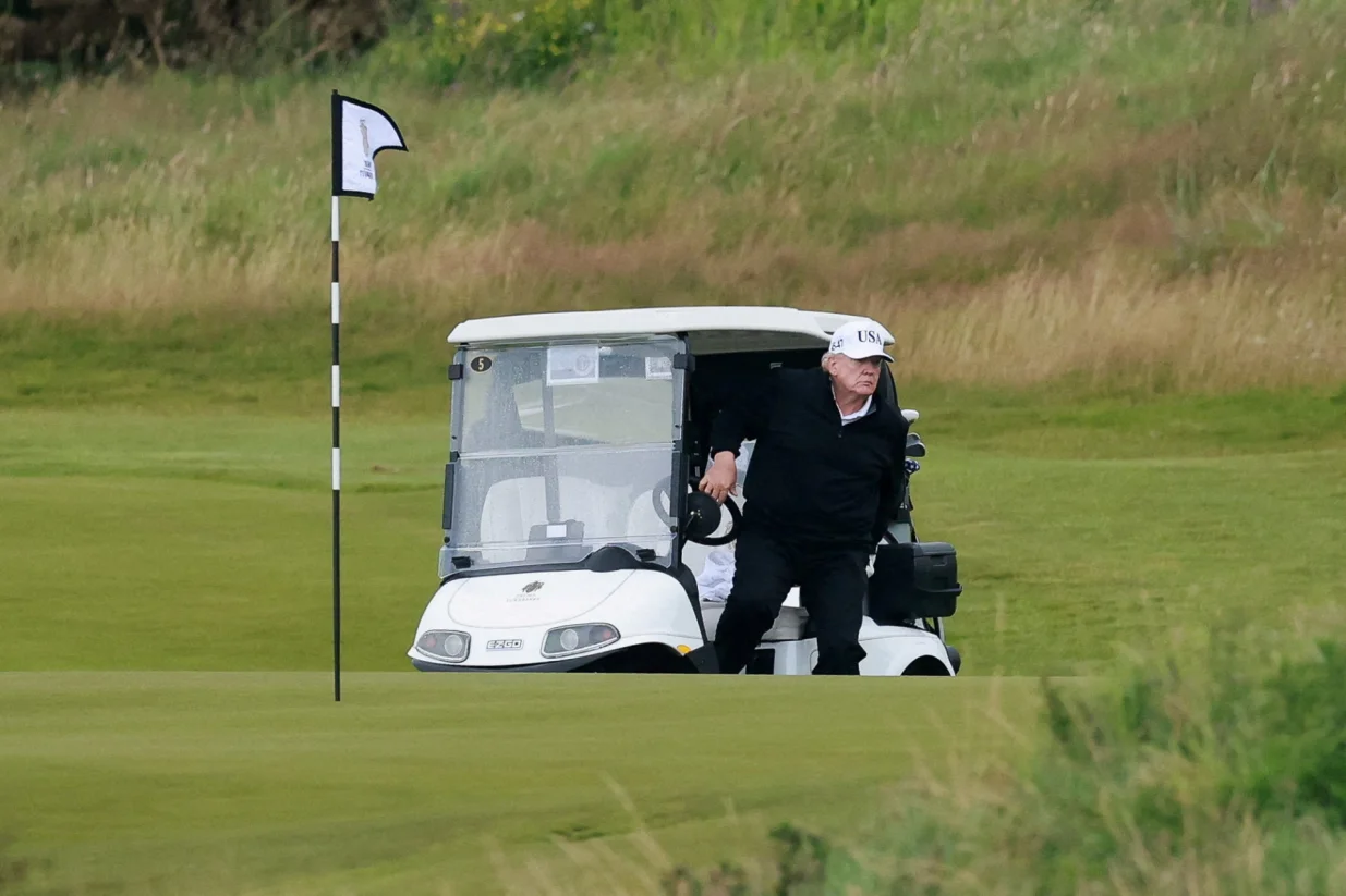 U.S. President Donald Trump walks out of a golf cart at Trump Turnberry resort, in Turnberry, Scotland, Britain, July 26, 2025. REUTERS/Phil Noble  TPX IMAGES OF THE DAY/Phil Noble