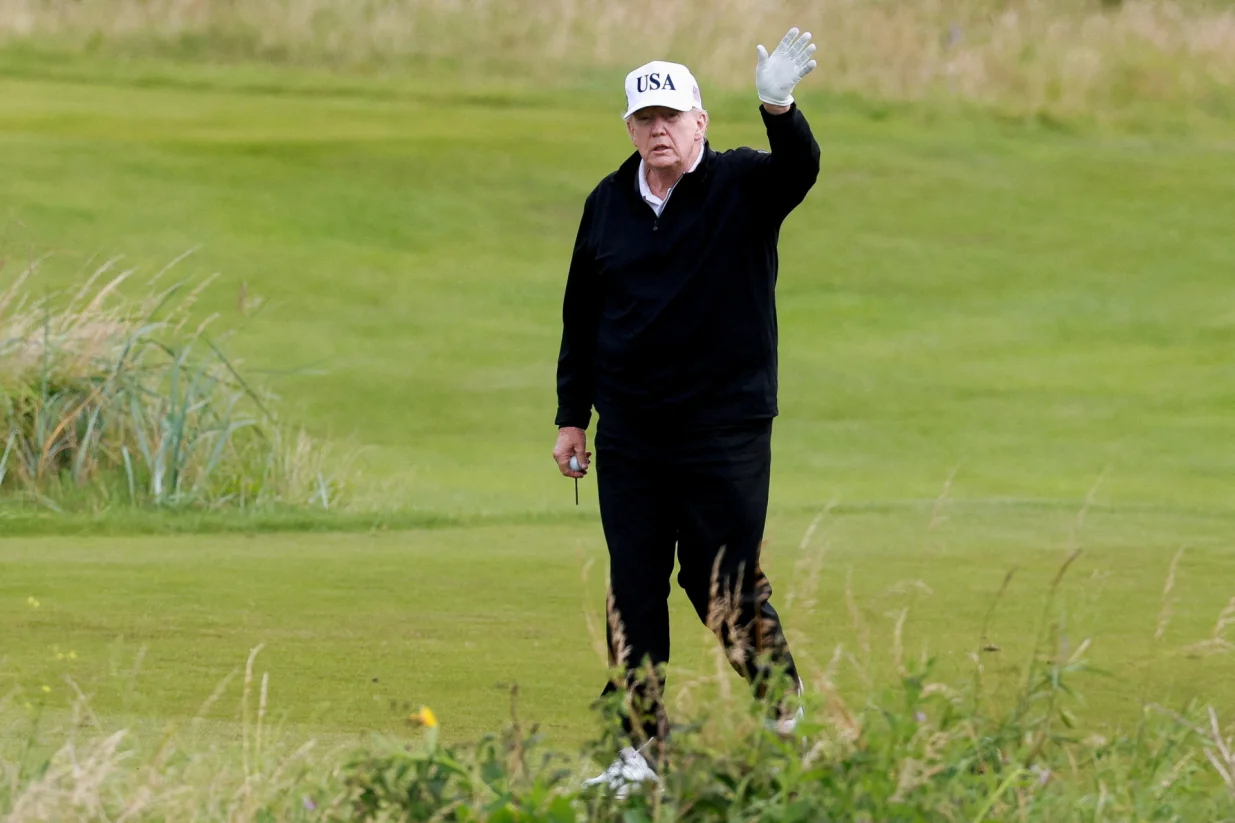 FILE PHOTO: U.S. President Donald Trump waves on the golf course at Trump Turnberry resort in Turnberry, Scotland, Britain, July 26, 2025. REUTERS/Phil Noble/File Photo/Phil Noble