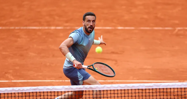 Tennis - French Open - Roland Garros, Paris, France - May 28, 2025 Bosnia's Damir Dzumhur in action during his second round match against France's Giovanni Mpetshi Perricard REUTERS/Lisi Niesner