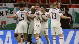 epa10318923 Timothy Weah (3L) of the USA celebrates with teammates after scoring the opening goal during the FIFA World Cup 2022 group B soccer match between the USA and Wales at Ahmad bin Ali Stadium in Doha, Qatar, 21 November 2022. EPA/Ronald Wittek