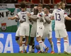 epa10318923 Timothy Weah (3L) of the USA celebrates with teammates after scoring the opening goal during the FIFA World Cup 2022 group B soccer match between the USA and Wales at Ahmad bin Ali Stadium in Doha, Qatar, 21 November 2022. EPA/Ronald Wittek