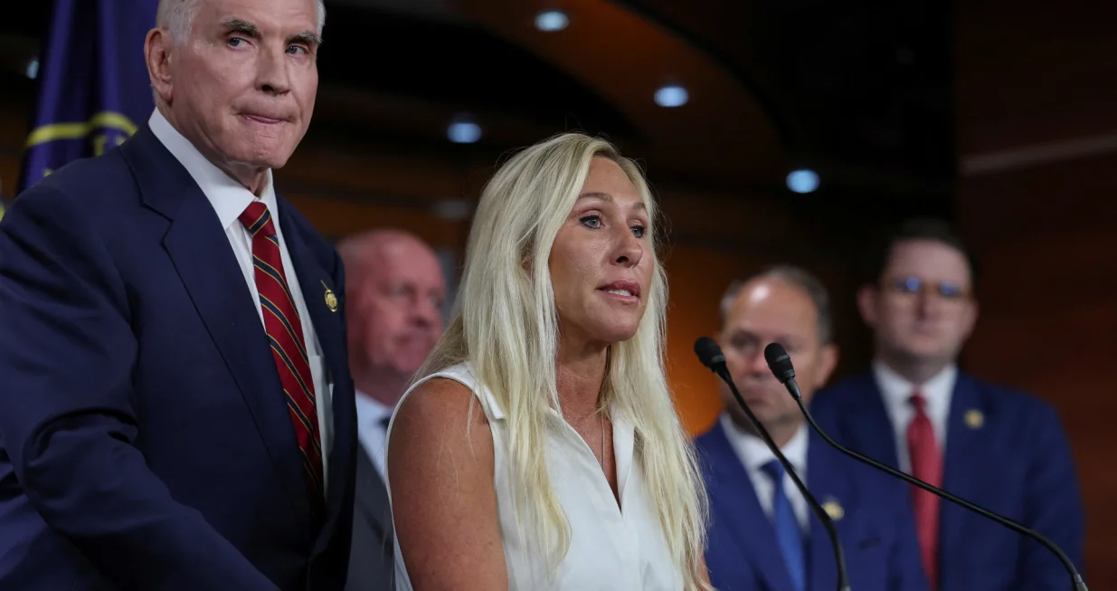 U.S. Representative Marjorie Taylor Greene (R-GA), with Rep. Mike Kelly (R-PA), joins House Republican Study Committee members as they hold a press conference to discuss their resolution against hateful political rhetoric on the one-year anniversary of the Butler, PA, shooting of then-candidate Donald Trump, on Capitol Hill in Washington, D.C., U.S., July 14, 2025. REUTERS/Jonathan Ernst/Jonathan Ernst