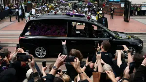 Crowds gather at the Black Sabbath Bridge, named in honour of the heavy metal band, as the funeral cortege of Ozzy Osbourne, its former frontman, passes through his hometown, in Birmingham, Britain, July 30, 2025. REUTERS/Jack Taylor  TPX IMAGES OF THE DAY/Jack Taylor