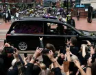 Crowds gather at the Black Sabbath Bridge, named in honour of the heavy metal band, as the funeral cortege of Ozzy Osbourne, its former frontman, passes through his hometown, in Birmingham, Britain, July 30, 2025. REUTERS/Jack Taylor  TPX IMAGES OF THE DAY/Jack Taylor