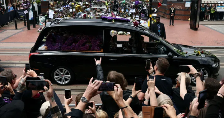 Crowds gather at the Black Sabbath Bridge, named in honour of the heavy metal band, as the funeral cortege of Ozzy Osbourne, its former frontman, passes through his hometown, in Birmingham, Britain, July 30, 2025. REUTERS/Jack Taylor  TPX IMAGES OF THE DAY/Jack Taylor