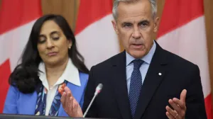Canada's Prime Minister Mark Carney speaks at a press conference about recognizing Palestinian statehood while Foreign Affairs Minister Anita Anand listens, in Ottawa, Ontario, Canada, July 30, 2025. REUTERS/Patrick Doyle  TPX IMAGES OF THE DAY/Patrick Doyle
