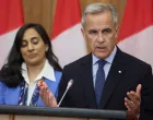 Canada's Prime Minister Mark Carney speaks at a press conference about recognizing Palestinian statehood while Foreign Affairs Minister Anita Anand listens, in Ottawa, Ontario, Canada, July 30, 2025. REUTERS/Patrick Doyle  TPX IMAGES OF THE DAY/Patrick Doyle