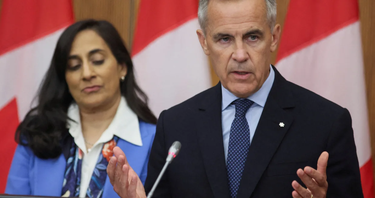 Canada's Prime Minister Mark Carney speaks at a press conference about recognizing Palestinian statehood while Foreign Affairs Minister Anita Anand listens, in Ottawa, Ontario, Canada, July 30, 2025. REUTERS/Patrick Doyle  TPX IMAGES OF THE DAY/Patrick Doyle