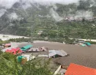 Houses are partially buried by a mudslide, amid flash floods, in Dharali, Uttarakhand, India, August 5, 2025. Indian Army Central Command via X/Handout via REUTERS THIS IMAGE HAS BEEN SUPPLIED BY A THIRD PARTY. MANDATORY CREDIT. TPX IMAGES OF THE DAY  VERIFICATION Reuters was able to confirm the location by buildings and terrain which matched file and satellite imagery. The date was verified by official and local media reports of flash flood in the area on Tuesday (August 5)./Indian Army Central Command Via