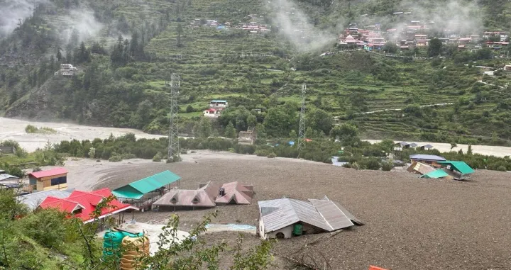 Houses are partially buried by a mudslide, amid flash floods, in Dharali, Uttarakhand, India, August 5, 2025. Indian Army Central Command via X/Handout via REUTERS THIS IMAGE HAS BEEN SUPPLIED BY A THIRD PARTY. MANDATORY CREDIT. TPX IMAGES OF THE DAY  VERIFICATION Reuters was able to confirm the location by buildings and terrain which matched file and satellite imagery. The date was verified by official and local media reports of flash flood in the area on Tuesday (August 5)./Indian Army Central Command Via