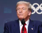 U.S. President Donald Trump reacts after signing an executive order to create a White House Olympics task force to handle security and other issues related to the LA 2028 summer Olympics in the South Court Auditorium on the White House campus in Washington, D.C., U.S., August 5, 2025. REUTERS/Jonathan Ernst/Jonathan Ernst