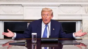 U.S. President Donald Trump gestures during a trilateral signing event with Armenia's Prime Minister Nikol Pashinyan and Azerbaijan's President Ilham Aliyev (not pictured), at the White House, in Washington, D.C., August 8, 2025. REUTERS/Kevin Lamarque/Kevin Lamarque