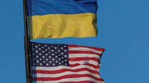 National flags of Ukraine and the United States wave over a building of American University, amid Russia's attack on Ukraine, in Kyiv, Ukraine August 9, 2025. REUTERS/Valentyn Ogirenko/Valentyn Ogirenko