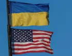 National flags of Ukraine and the United States wave over a building of American University, amid Russia's attack on Ukraine, in Kyiv, Ukraine August 9, 2025. REUTERS/Valentyn Ogirenko/Valentyn Ogirenko