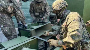 FILE PHOTO: South Korean soldiers work on a loudspeaker that is set up for propaganda broadcasts during a military drill near the demilitarized zone separating the two Koreas in Paju, South Korea, in this handout picture provided by the Defense Ministry and released on June 9, 2024. The Defense Ministry/Handout via REUTERS ATTENTION EDITORS - THIS IMAGE HAS BEEN SUPPLIED BY A THIRD PARTY./File Photo/The Defense Ministry