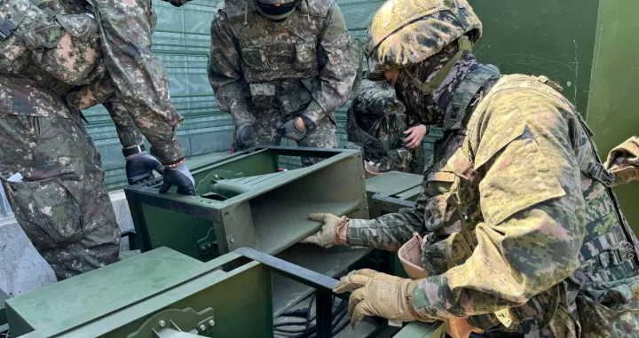 FILE PHOTO: South Korean soldiers work on a loudspeaker that is set up for propaganda broadcasts during a military drill near the demilitarized zone separating the two Koreas in Paju, South Korea, in this handout picture provided by the Defense Ministry and released on June 9, 2024. The Defense Ministry/Handout via REUTERS ATTENTION EDITORS - THIS IMAGE HAS BEEN SUPPLIED BY A THIRD PARTY./File Photo/The Defense Ministry