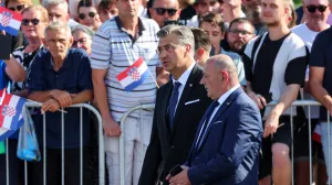 Croatia's Prime Minister Andrej Plenkovic walks with Deputy Prime Minister and Minister of Croatian Veterans' Affairs Tomo Medved, ahead of a military parade for the 30th anniversary of Operation Storm alongside Victory Day, Homeland Thanksgiving Day, and Croatian Veterans Day, in downtown Zagreb, Croatia, July 31, 2025. REUTERS/Antonio Bronic/Antonio Bronic