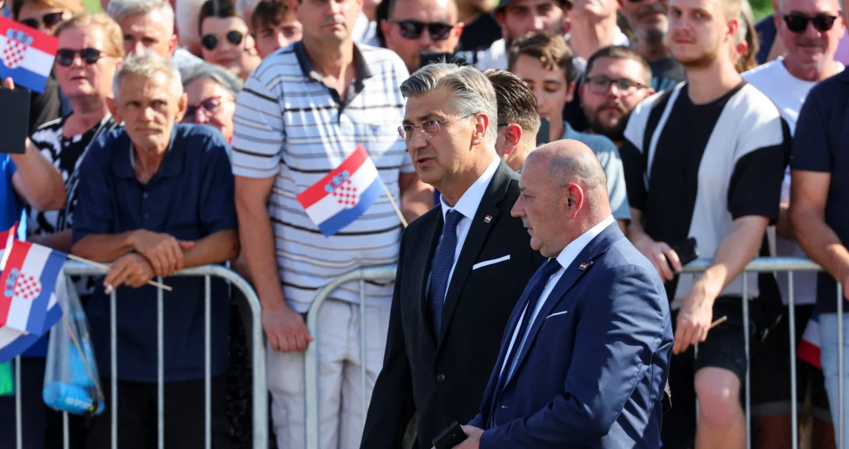 Croatia's Prime Minister Andrej Plenkovic walks with Deputy Prime Minister and Minister of Croatian Veterans' Affairs Tomo Medved, ahead of a military parade for the 30th anniversary of Operation Storm alongside Victory Day, Homeland Thanksgiving Day, and Croatian Veterans Day, in downtown Zagreb, Croatia, July 31, 2025. REUTERS/Antonio Bronic/Antonio Bronic