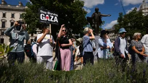 People attend a rally organised by Defend Our Juries, challenging the British government's proscription of "Palestine Action" under anti-terrorism laws, in Parliament Square, in London, Britain, August 9, 2025. REUTERS/Jaimi Joy/Jaimi Joy