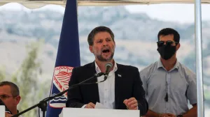Israeli Finance Minister Bezalel Smotrich speaks at a press conference regarding settlements expansion for the long-frozen E1 settlement, that would split East Jerusalem from the occupied West Bank, near the Israeli settlement of Maale Adumim in the Israeli-occupied West Bank, August 14, 2025. REUTERS/Ronen Zvulun/Ronen Zvulun