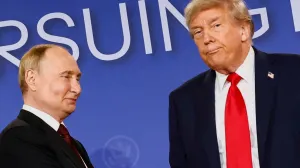 U.S. President Donald Trump looks on next to Russian President Vladimir Putin during a press conference following their meeting to negotiate an end to the war in Ukraine, at Joint Base Elmendorf-Richardson, in Anchorage, Alaska, U.S., August 15, 2025. REUTERS/Kevin Lamarque  TPX IMAGES OF THE DAY/Kevin Lamarque