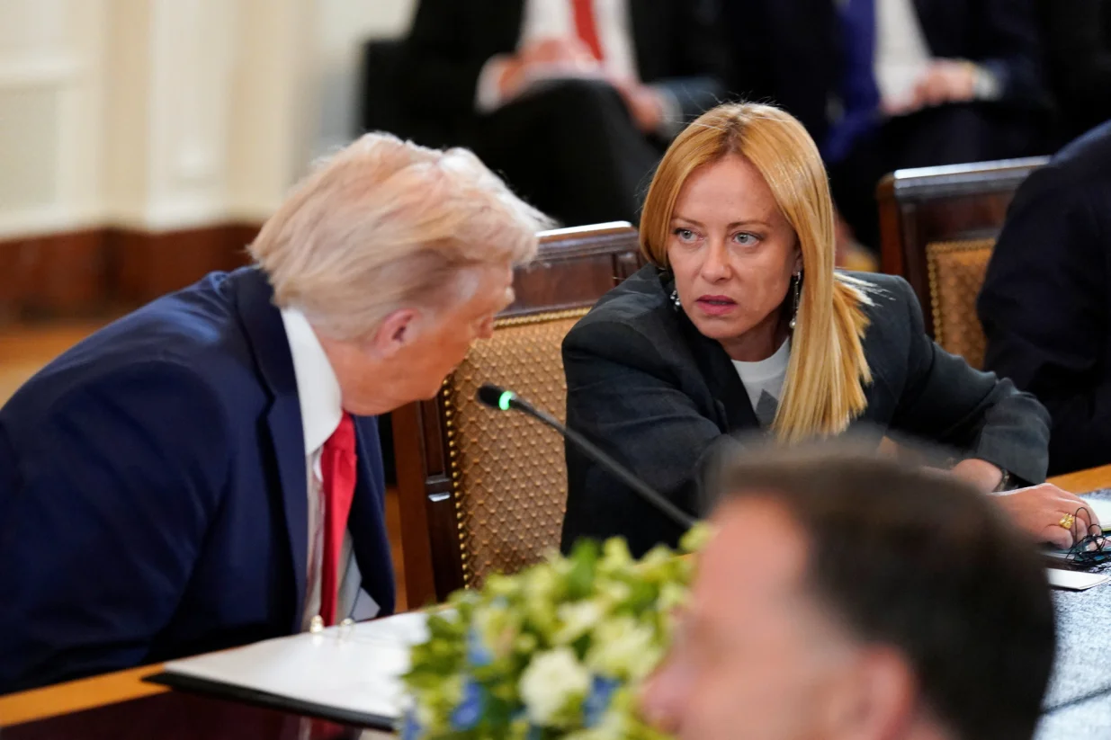 U.S. President Donald Trump speaks with Italian Prime Minister Giorgia Meloni during a meeting amid negotiations to end the Russian war in Ukraine, at the White House in Washington, D.C., U.S., August 18, 2025. REUTERS/Alexander Drago/Alexander Drago
