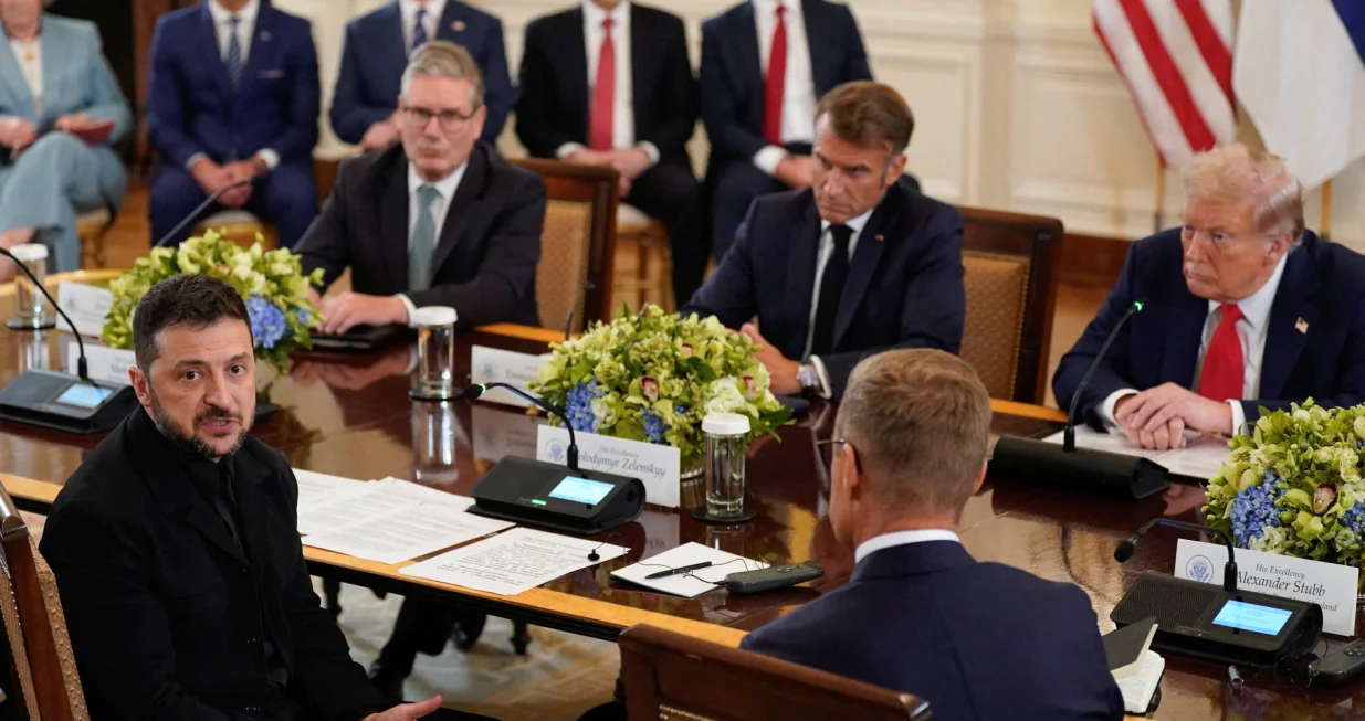 Ukrainian President Volodymyr Zelenskiy speaks during a meeting with U.S. President Donald Trump, French President Emmanuel Macron, British Prime Minister Keir Starmer, and Finland's President Alexander Stubb amid negotiations to end the Russian war in Ukraine, at the White House in Washington, D.C., U.S., August 18, 2025. REUTERS/Alexander Drago  TPX IMAGES OF THE DAY/Alexander Drago
