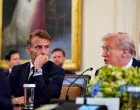 French President Emmanuel Macron speaks to U.S. President Donald Trump during a meeting with Ukrainian President Volodymyr Zelenskiy (not pictured) and European leaders amid negotiations to end the Russian war in Ukraine, at the White House in Washington, D.C., U.S., August 18, 2025. REUTERS/Al Drago/Alexander Drago