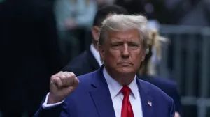 FILE PHOTO: Former U.S. President Donald Trump gestures to his supporters, on the day of the closing arguments in the Trump Organization civil fraud trial, outside a Trump property in the Manhattan borough of New York City, U.S., January 11, 2024. REUTERS/David Dee Delgado/File Photo/David Dee Delgado